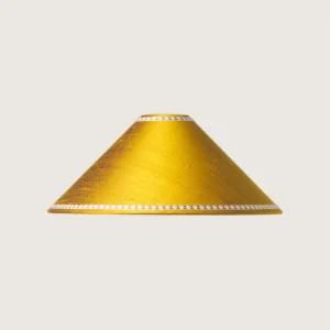 Tasiemki.kolor5 A beautifully formed yellow conical lampshade, decorated with a delicate geometric pattern along the top and bottom edges.