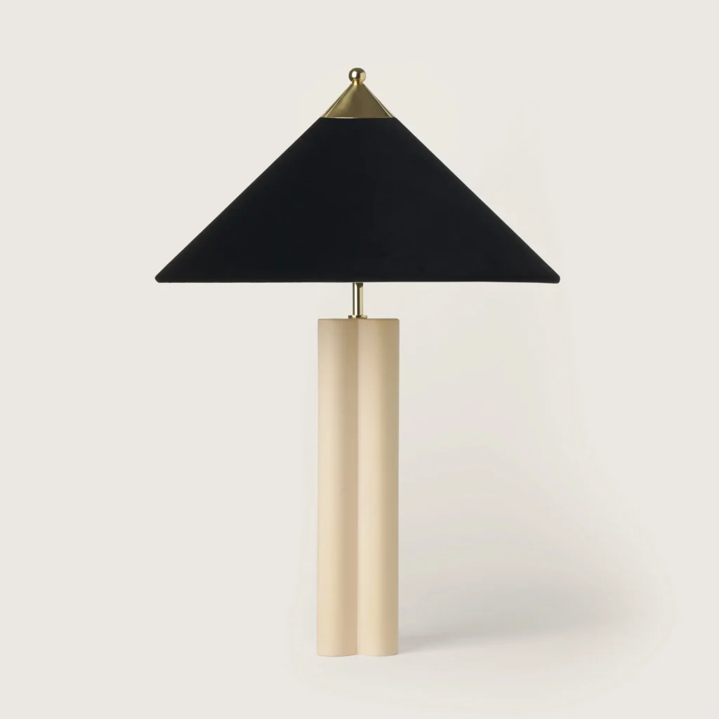 Elegant table lamp with a grey velvet shade and cream base.